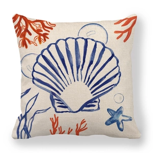 Detailed view of square linen pillowcase with hand-painted blue shell and coral print
