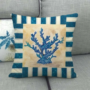 Detailed view of ocean style cushion cover with blue coral print and striped border