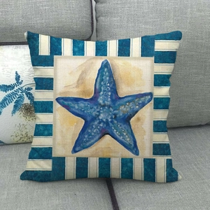 Detailed texture of square pillowcase featuring navy starfish and blue striped borders