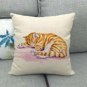 Detailed texture of linen cushion cover featuring a watercolor orange sleeping cat design