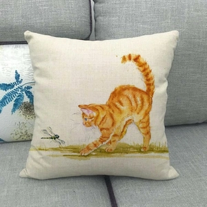 Detailed texture of linen cushion cover featuring a hand-painted orange tabby cat art