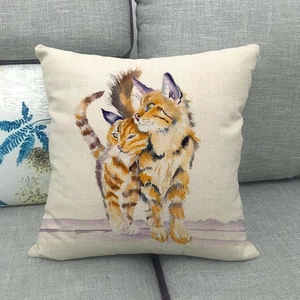 Detailed texture of linen cushion cover featuring two watercolor orange tabby cats on sofa