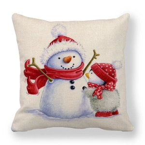 Detail of linen pillowcase featuring hand-drawn Christmas snowman and penguin illustration