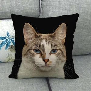 Detailed close-up of a realistic cat portrait with blue eyes on a black linen pillowcase