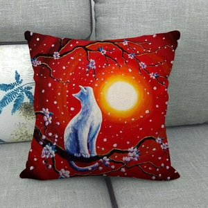 Close-up of a linen cushion cover featuring a white cat sitting on cherry blossoms