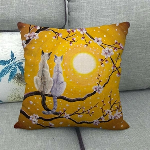 Close-up of linen pillowcase with cats on flower branches and golden moon art