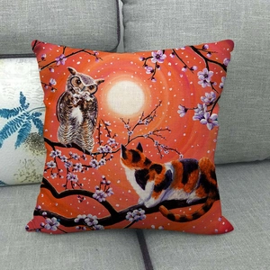 Close-up of linen pillow cover featuring a cute cat and owl under a warm moonlit scene