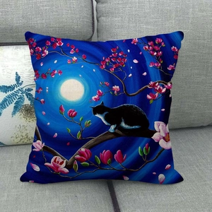 Artistic linen pillowcase featuring a cat in moonlight floral scene on a grey sofa