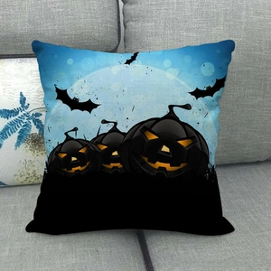 Detail of Halloween linen pillowcase featuring pumpkin and bat silhouettes on a sofa