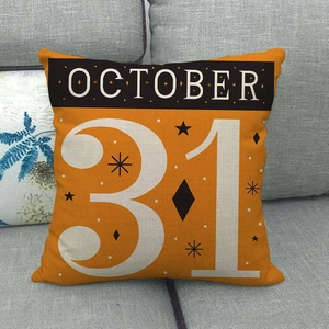 Detail view of Halloween linen pillowcase featuring October 31 design on a sofa