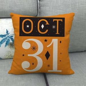 Halloween orange linen throw pillow cover with OCT 31 print on a grey sofa