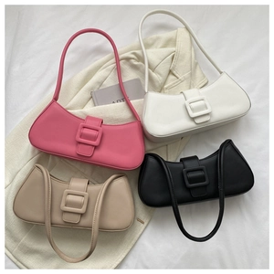 Flat lay of vintage baguette shoulder bags in pink, white, black and khaki matte leather
