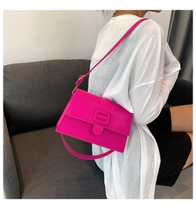 Close-up of rose red PU leather crossbody bag featuring a trendy square flap and buckle