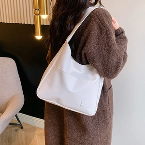 Minimalist white PU leather tote bag with large capacity pocket and wide shoulder strap