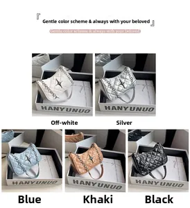 Collection of quilted underarm bags in cream, silver, blue, khaki and black with star detail