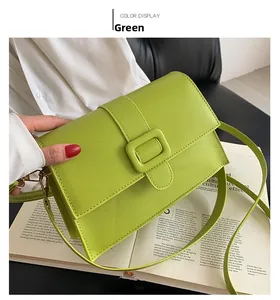 Detail view of lime green lychee leather square bag with vintage hardware and flap cover