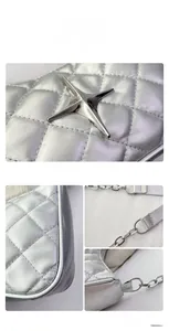 Detail of silver quilted leather crossbody bag with star logo and metal chain strap