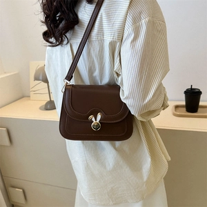 Vintage brown leather crossbody bag with a cute white rabbit metal twist lock for women