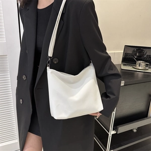 Minimalist white pebble leather Hobo crossbody bag for women, perfect for daily commuting