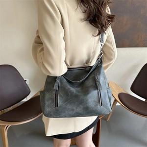 Chic grey-green vintage leather tote bag for women with adjustable strap and dual zippers