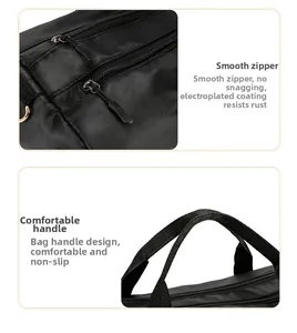 Detail of durable electroplated metal zipper and reinforced fabric handles on a black gym bag