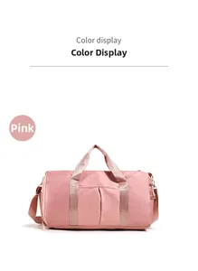 Detail view of pink cylinder sports bag featuring durable nylon and woven handles