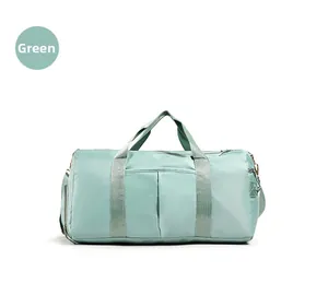 Detailed view of water-resistant mint green nylon sports bag with reinforced handles