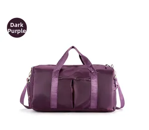 Detail view of deep purple travel bag featuring waterproof nylon and gold-tone hardware