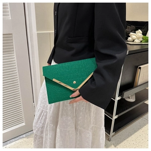 Green faux crocodile envelope clutch bag with gold metal edge detailing