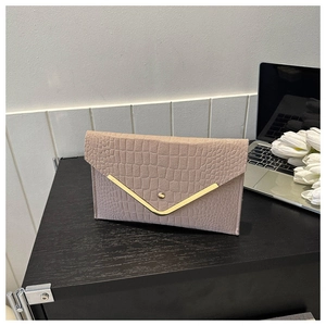 Pink crocodile texture envelope clutch bag with gold V-shaped metal trim detail