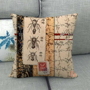 Linen pillowcase featuring vintage bee illustrations and scientific diagrams on a sofa