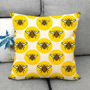 Detailed view of yellow bee and honeycomb pattern on natural linen pillowcase fabric