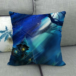 Halloween pillowcase featuring a spooky gothic castle with spider webs on a gray sofa