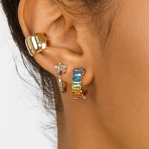 Chic gold-plated C-shaped earrings set with colorful cubic zirconia on a female model
