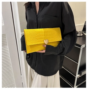 Yellow crocodile pattern envelope clutch bag with gold heart-shaped magnetic buckle
