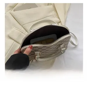 Interior view showing the large capacity of the vintage monogram shell bag for women