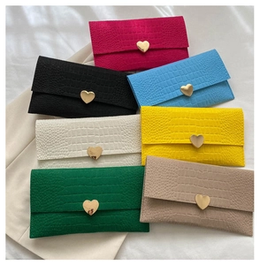 Detailed collection of crocodile pattern envelope clutch wallets in seven bright colors