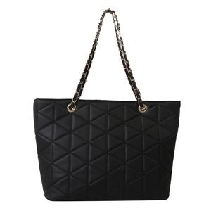 Minimalist black quilted tote bag with triangle stitching and gold chain straps