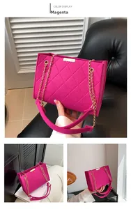 Detail of rose red felt crossbody bag with diamond quilting and gold chain strap