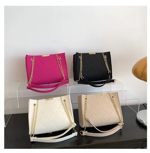 Chic quilted felt shoulder bags in rose, black, white, and beige with gold chain straps