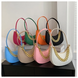 Collection of crocodile pattern crescent bags in eight colors with chunky gold chains