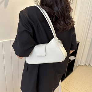 Minimalist white PU leather baguette shoulder bag for women shown with casual office blazer