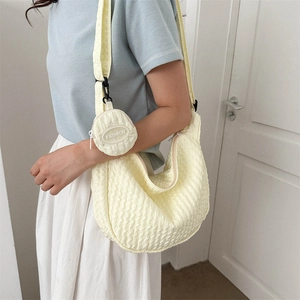 Beige pleated crescent shoulder bag with a mini fashion round purse accessory