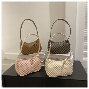 Retro geometric pattern hobo bags shown in four colors on white minimalist props