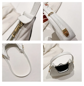 Detail view of white ruched hobo bag with gold zipper and quilted PU leather texture