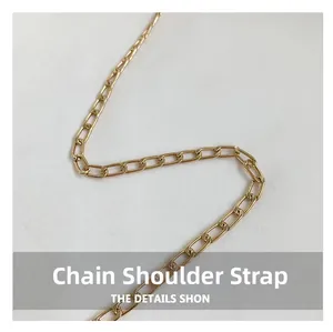 Macro shot of elegant golden metal chain strap with flat rectangular links for bags