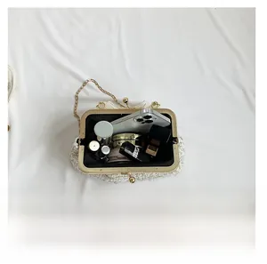 Internal view of tweed shell bag showing capacity for phone, lipstick and cushion foundation