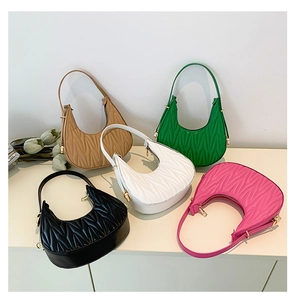 Detailed collection of five colorful quilted crescent hobo bags with wave patterns