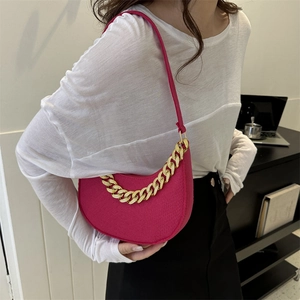 Chic magenta felt hobo bag with a chunky gold chain strap and slim faux leather shoulder strap