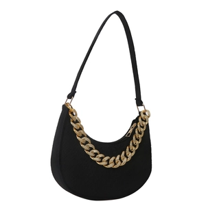 Minimalist black felt hobo bag with a thick gold rhinestone chunky chain accessory